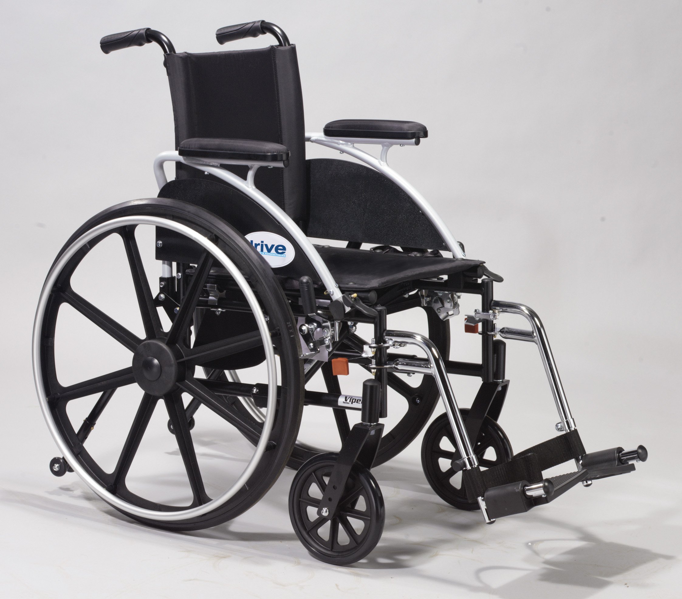 A wheelchair with wheels and the seat folded down.