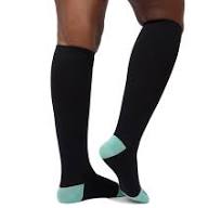 Pair of black knee-high socks with light blue heels worn on legs.